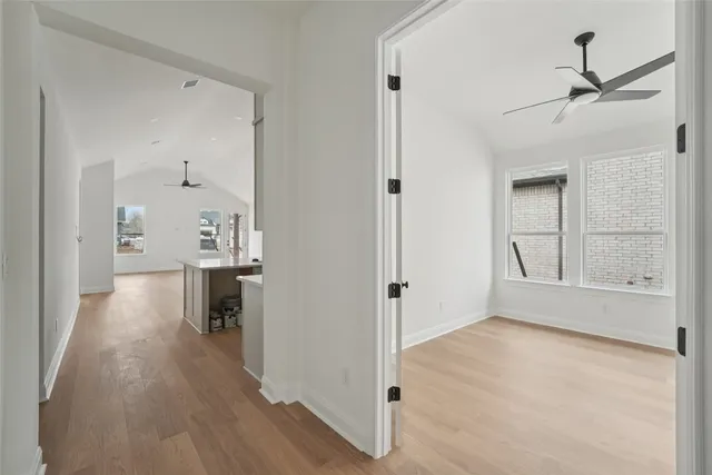 a view of a kitchen with a sink and a refrigerator