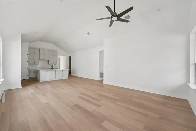 a kitchen with cabinets a sink and a stove