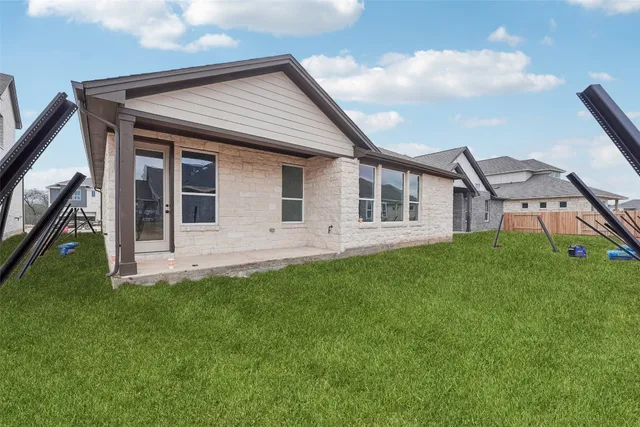 a picture of a table and chairs in a garden