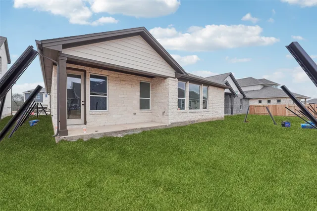 a picture of a table and chairs in a garden