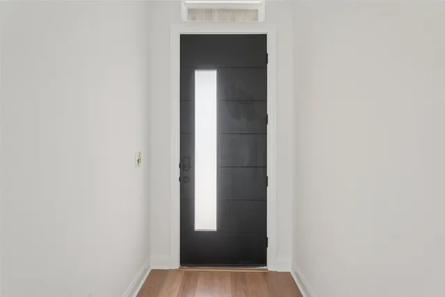 wooden floor with white walls