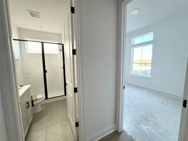 a view of an empty room with a window