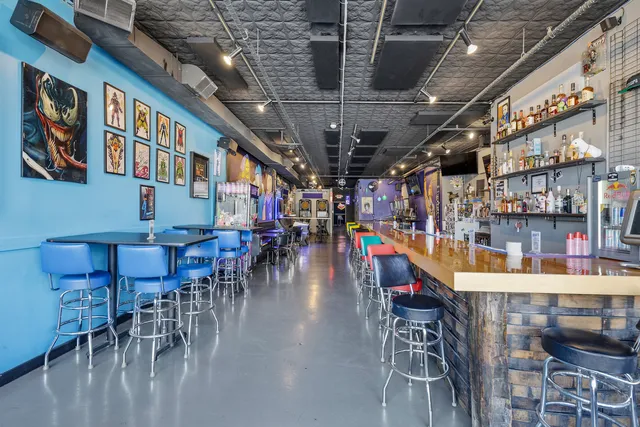 a dining room with lots of furniture and a chandelier