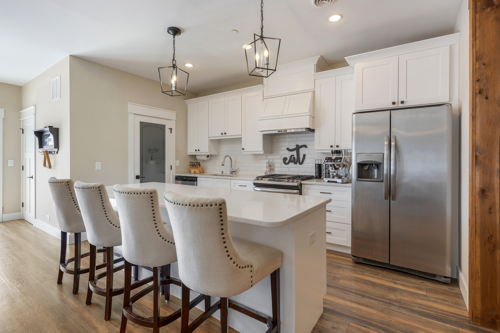 219 West Main Street St. Charles, IL 60174 - Photo 6 of 30 a kitchen with stainless steel appliances granite countertop a dining table chairs refrigerator and microwave