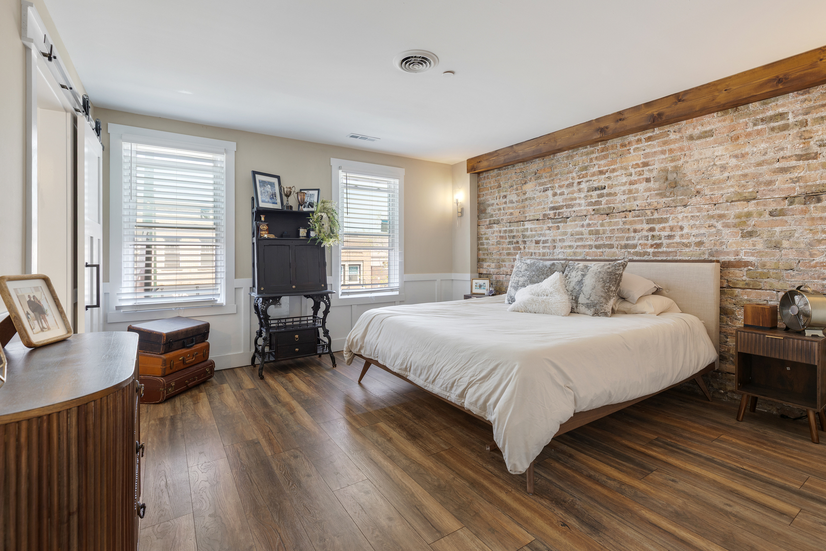 219 West Main Street St. Charles, IL 60174 - Photo 10 of 30 a bedroom with a bed and wooden floor