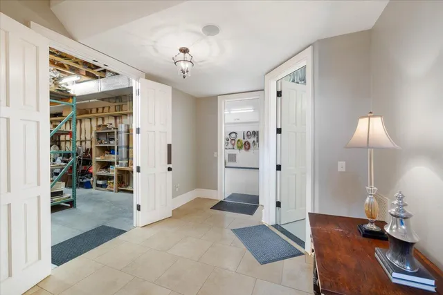 a bathroom with a granite countertop sink and a large mirror