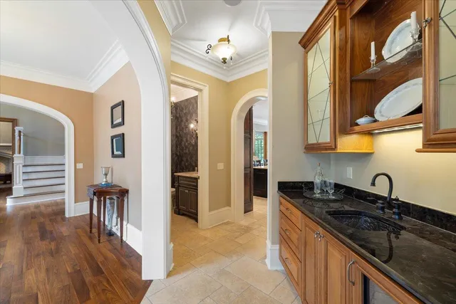 a bathroom with a toilet a sink and a window