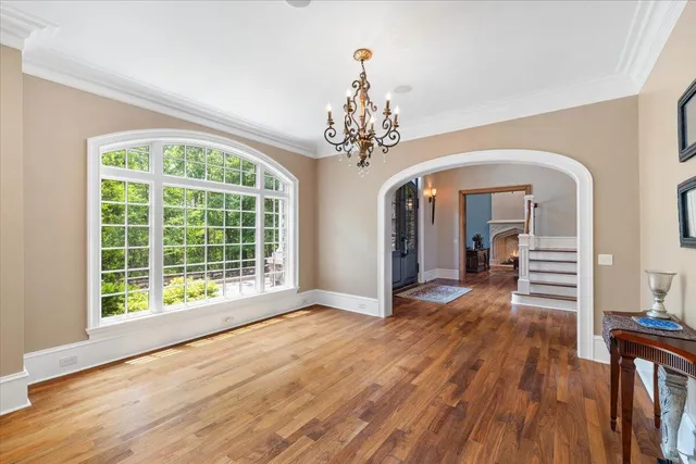 a bathroom with a sink a toilet and a large mirror