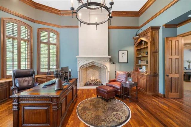 a view of a lush green forest with trees and some houses