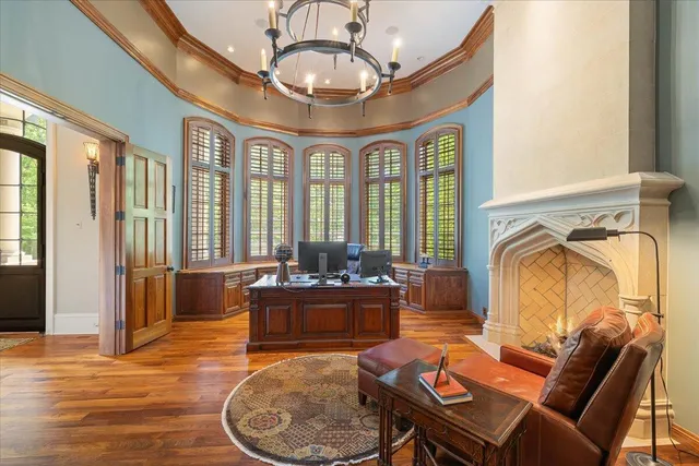 an aerial view of a house with outdoor space and a lake view