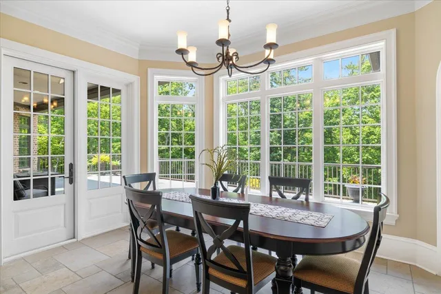 a bathroom with a granite countertop sink and a large mirror