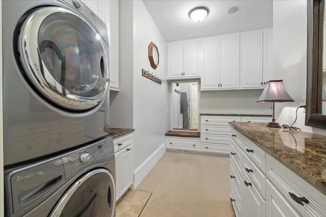 a front view of a house with swimming pool and porch