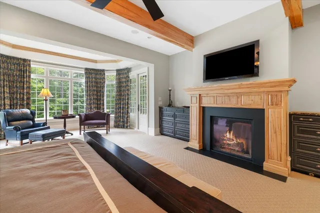 a view of a livingroom with furniture and a ceiling fan