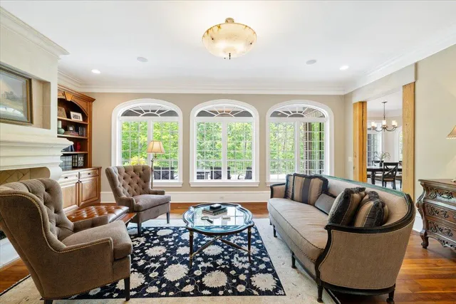 a large kitchen with stainless steel appliances a stove a sink dishwasher and cabinets with wooden floor