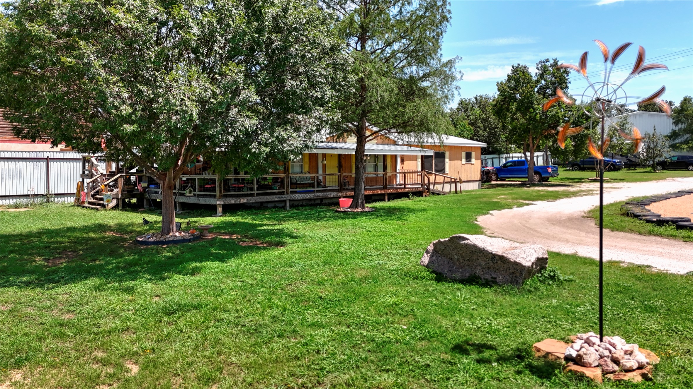 1504 Ranch Road 261 Buchanan Dam, TX 78609 - Photo 19 of 37 View of grassy yard with a deck