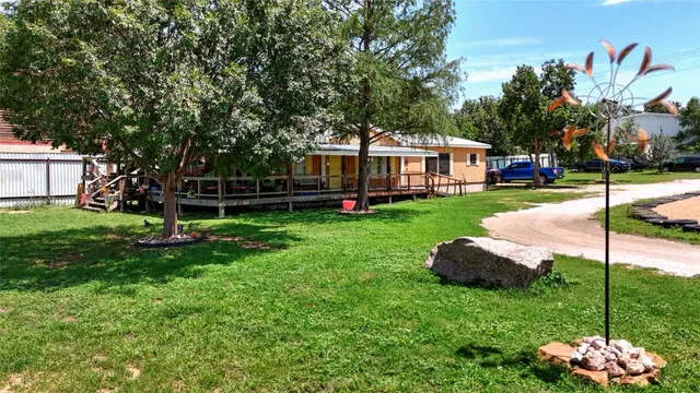 a view of a house with a yard porch and sitting area