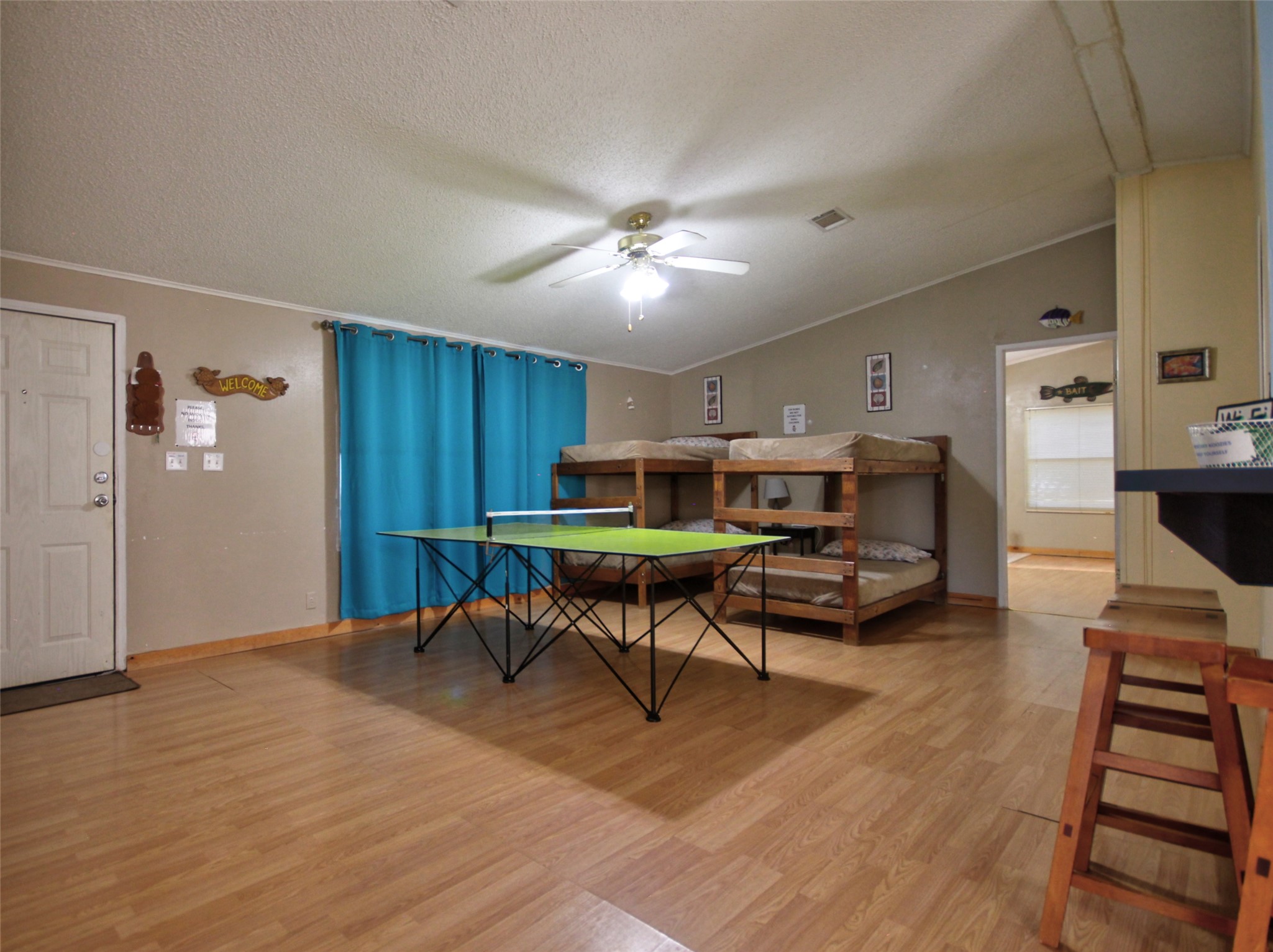 1504 Ranch Road 261 Buchanan Dam, TX 78609 - Photo 25 of 37 a living room with furniture and a wooden floor