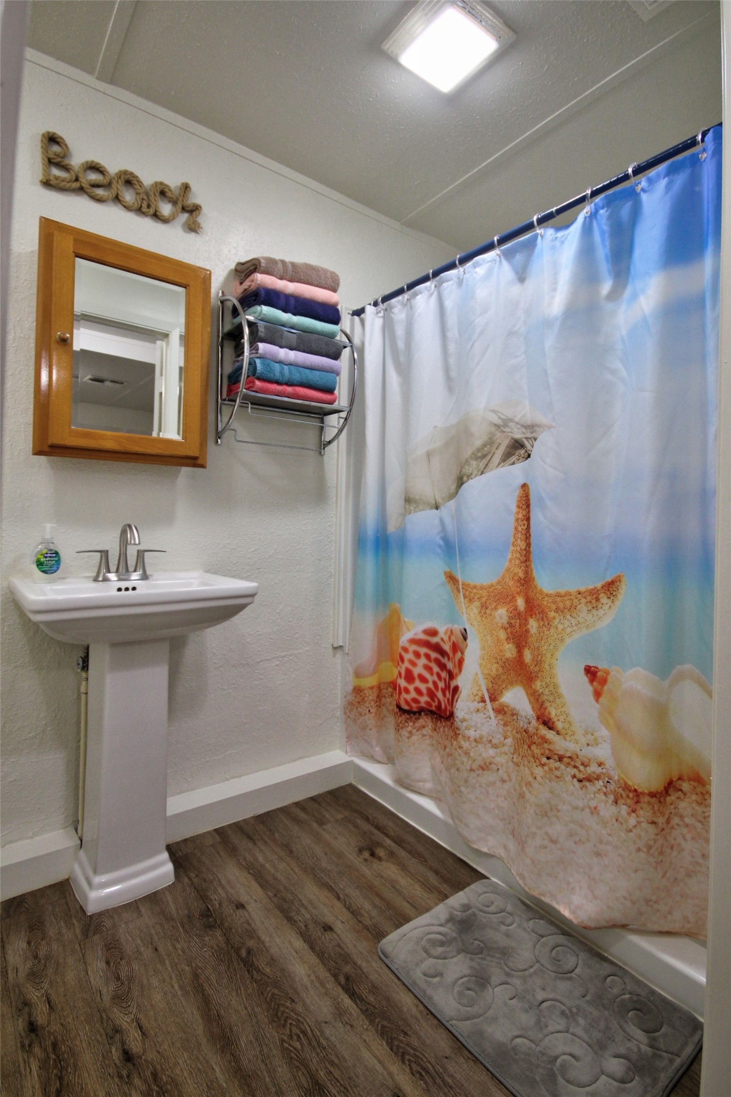 1504 Ranch Road 261 Buchanan Dam, TX 78609 - Photo 29 of 37 a bathroom with a sink and a mirror