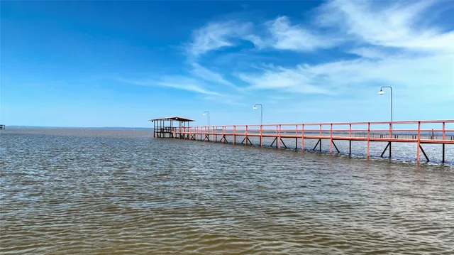 a view of a yard with an ocean