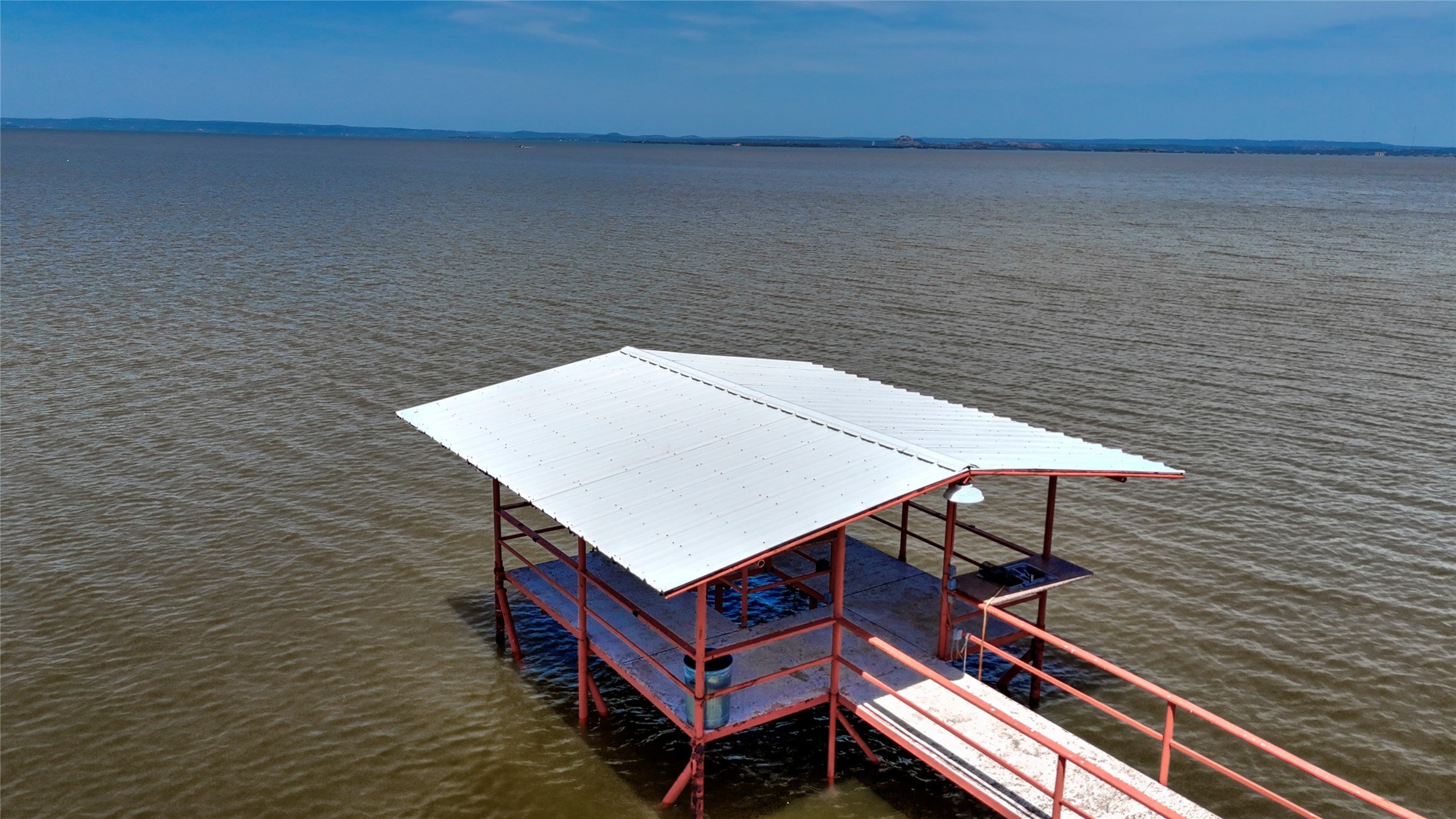 1504 Ranch Road 261 Buchanan Dam, TX 78609 - Photo 35 of 37 a terrace of a building with table and chairs