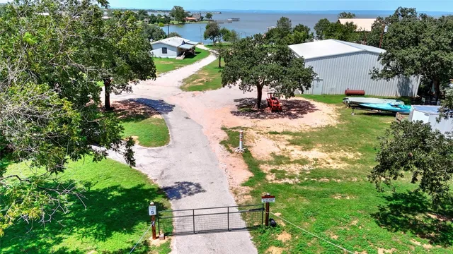 an aerial view of a house with yard swimming pool and outdoor seating