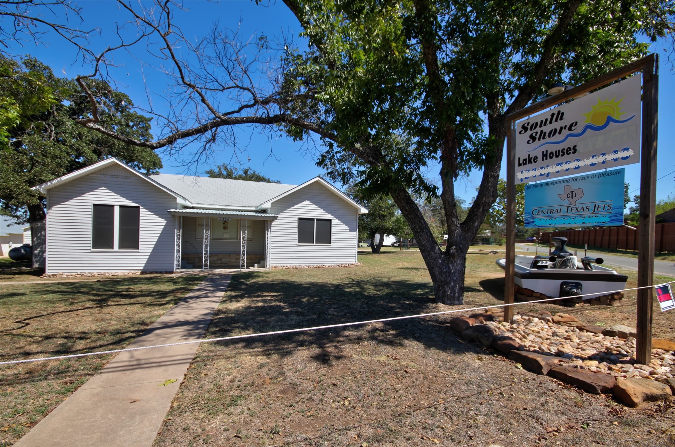 1504 Ranch Road 261 Buchanan Dam, TX 78609 - Photo 7 of 37 a white house that has tree in front of it