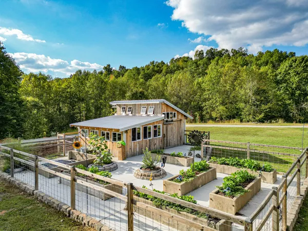 a building outdoor space with patio furniture and potted plants