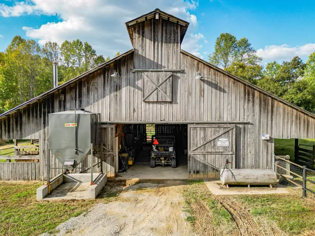 a view of a porch with wooden floor and furniture