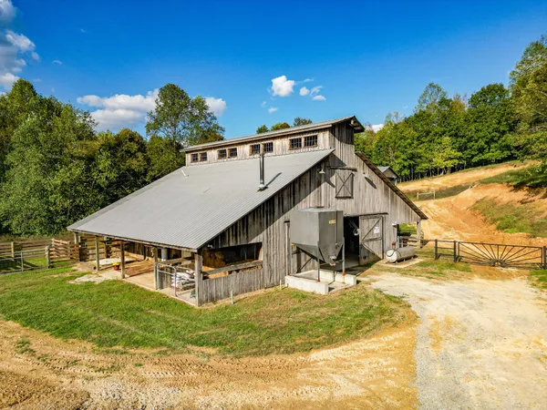 a view of a house with wooden fence