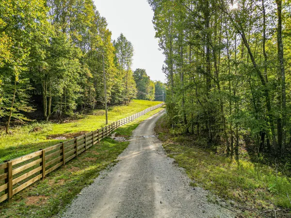a front view of a house with a yard table and chairs