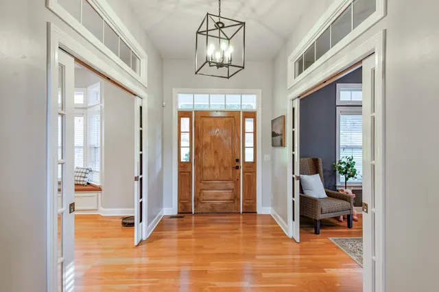 a bedroom with a bed and a refrigerator