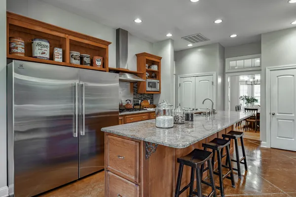a bedroom with a bed couch and a window