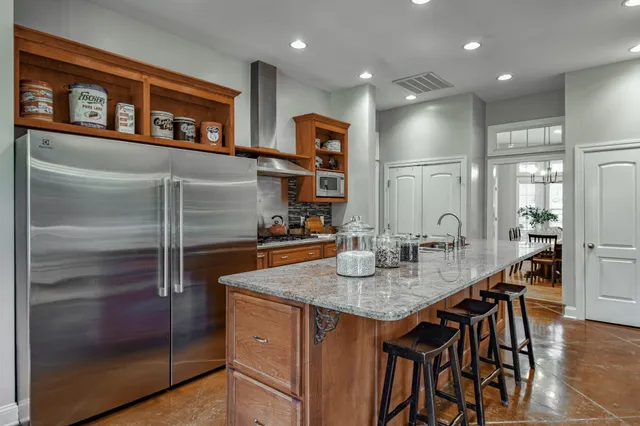 a bedroom with a bed couch and a window