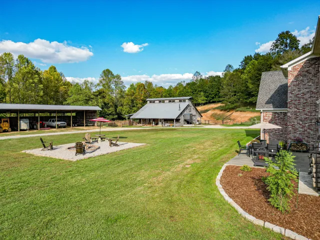 an outdoor space with furniture and garden