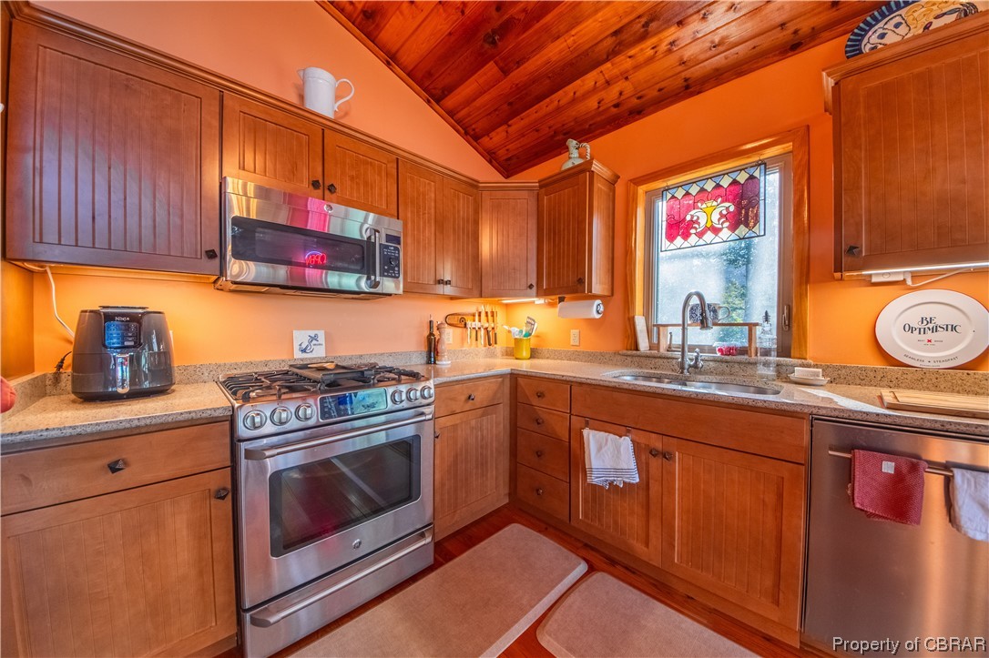 1239 Kelley Neck Road Lancaster, VA 22503 - Photo 33 of 48 Kitchen featuring wooden ceiling, vaulted ceiling, light hardwood / wood-style flooring, sink, and stainless steel appliances
