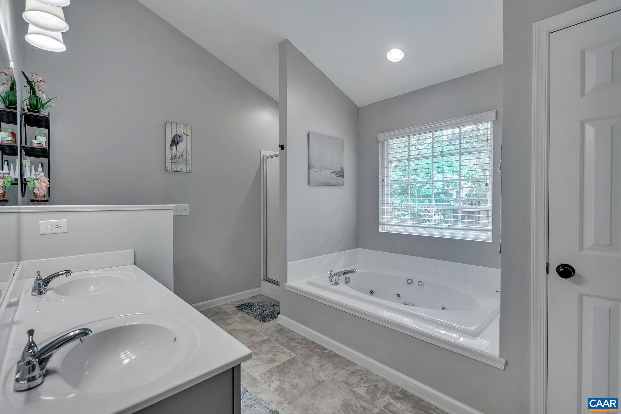 57 Amethyst Road Palmyra, VA 22963 - Photo 18 of 36 a bathroom with a tub sink and mirror