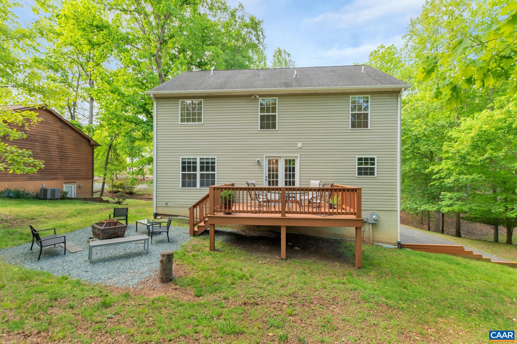57 Amethyst Road Palmyra, VA 22963 - Photo 29 of 36 a backyard of a house with table and chairs