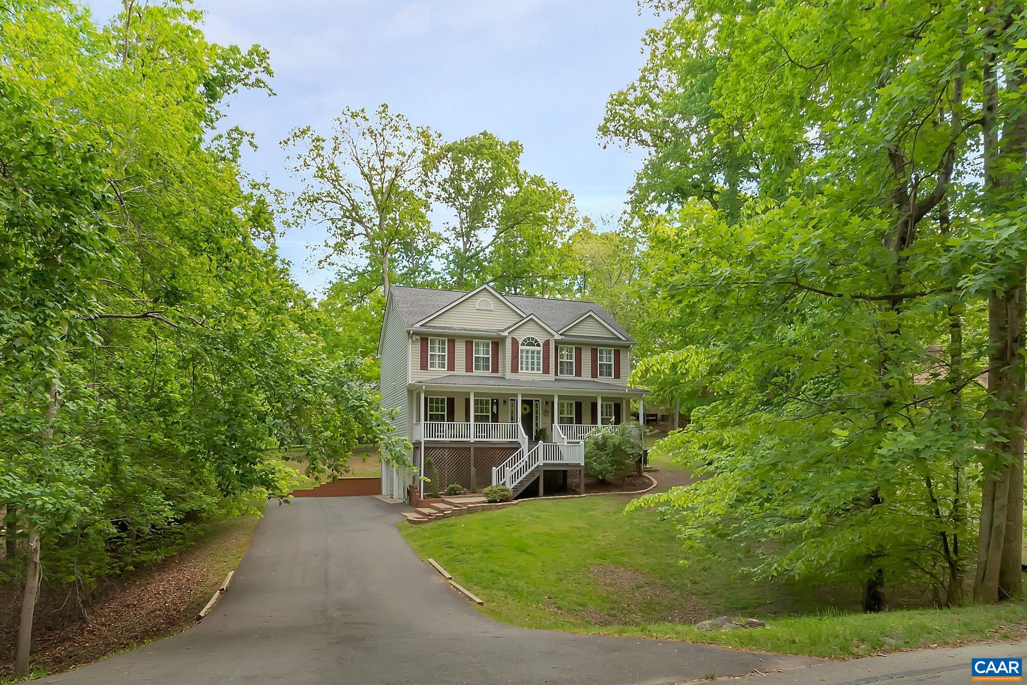 57 Amethyst Road Palmyra, VA 22963 - Photo 30 of 36 a view of a house with a yard and potted plants