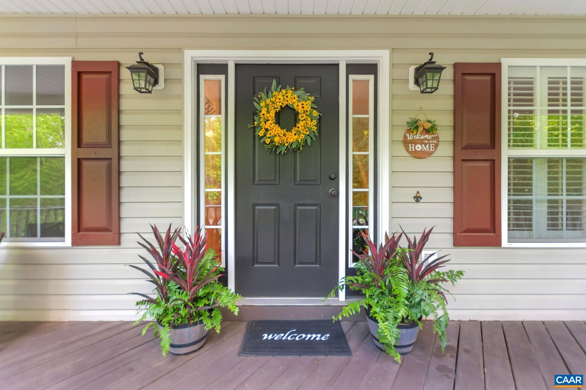 57 Amethyst Road Palmyra, VA 22963 - Photo 3 of 36 a vase with flowers on front of door