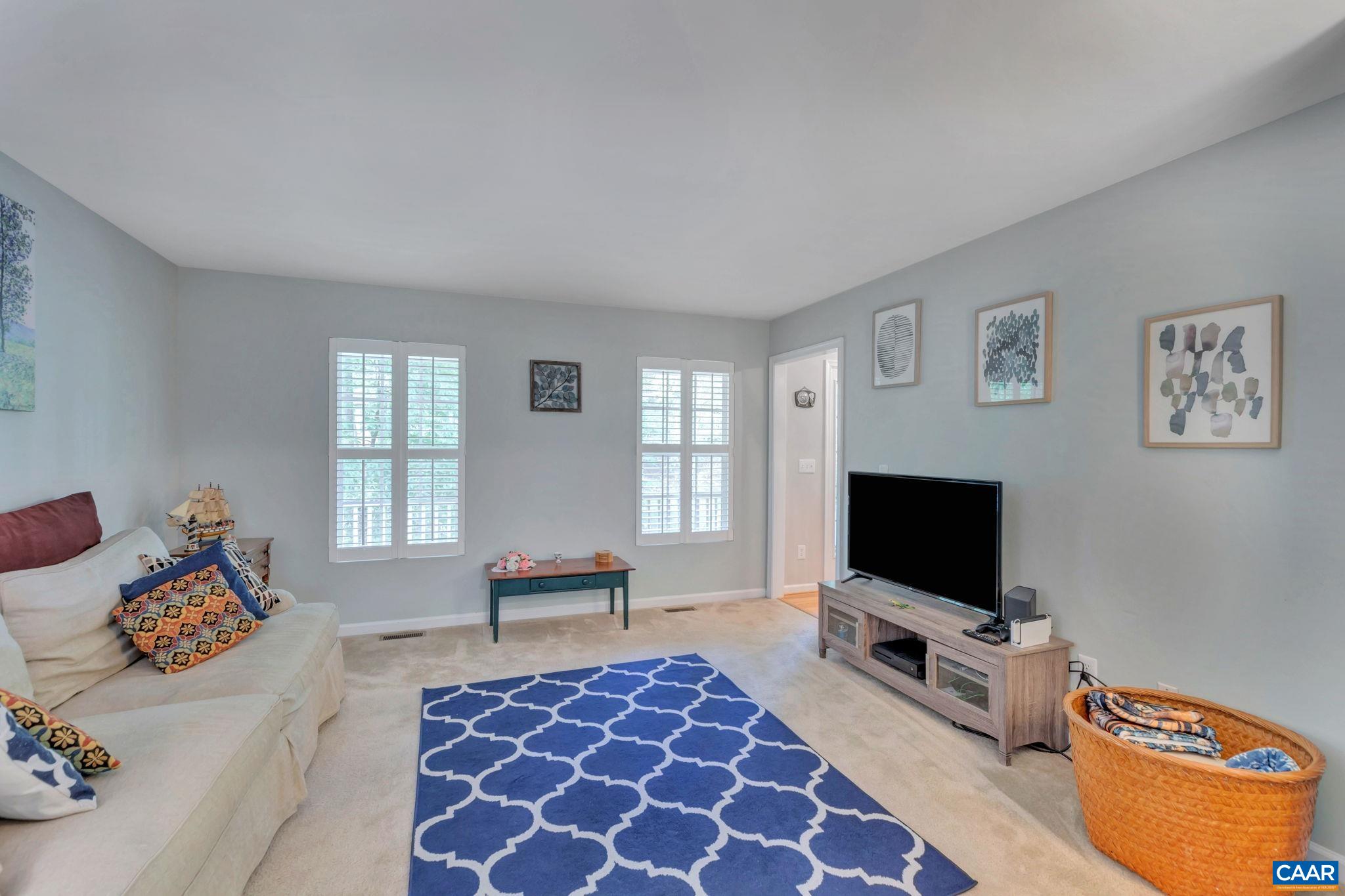 57 Amethyst Road Palmyra, VA 22963 - Photo 9 of 36 a living room with furniture and a flat screen tv