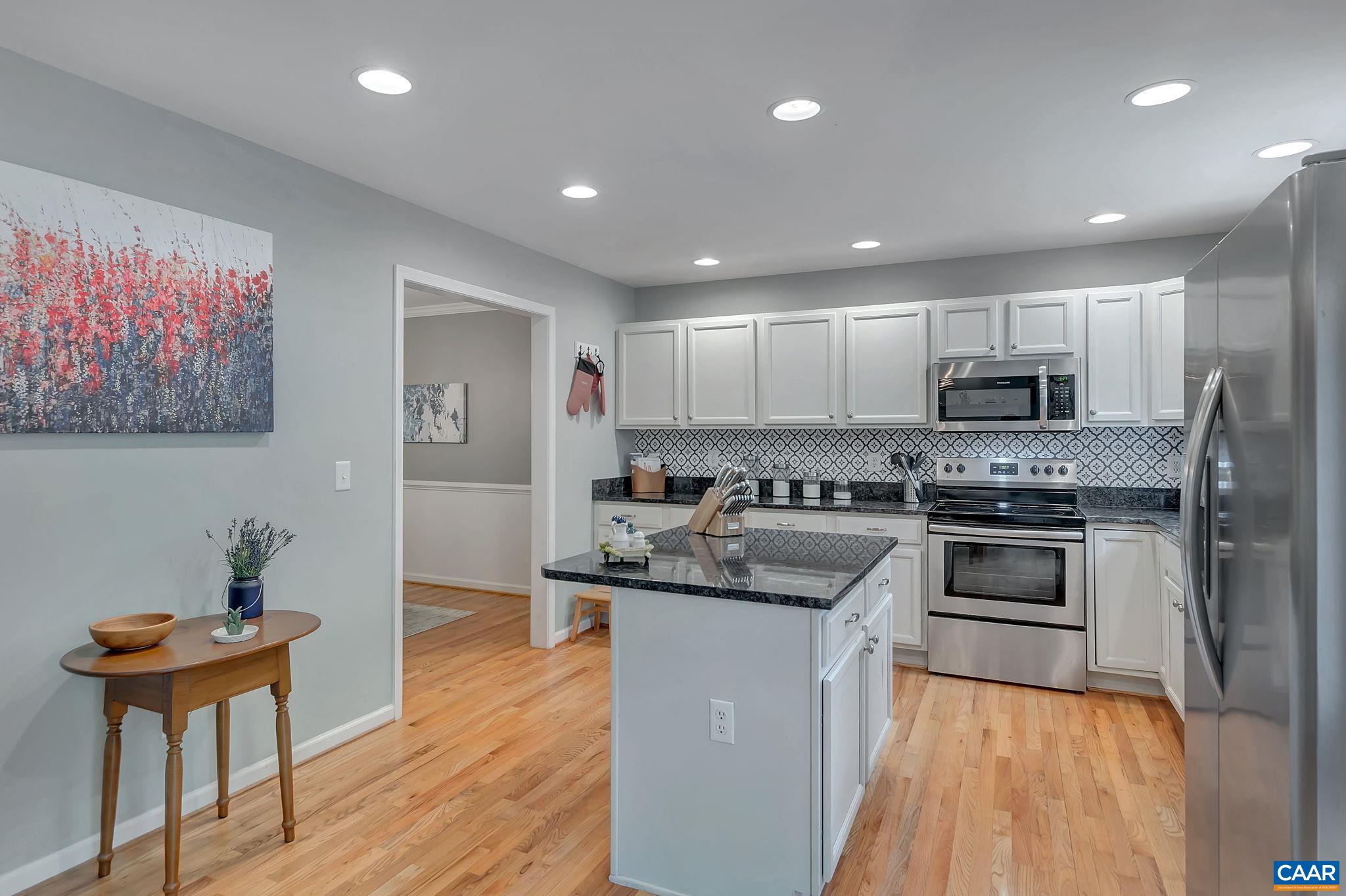 57 Amethyst Road Palmyra, VA 22963 - Photo 10 of 36 a kitchen with stainless steel appliances granite countertop a stove a sink a refrigerator and a microwave