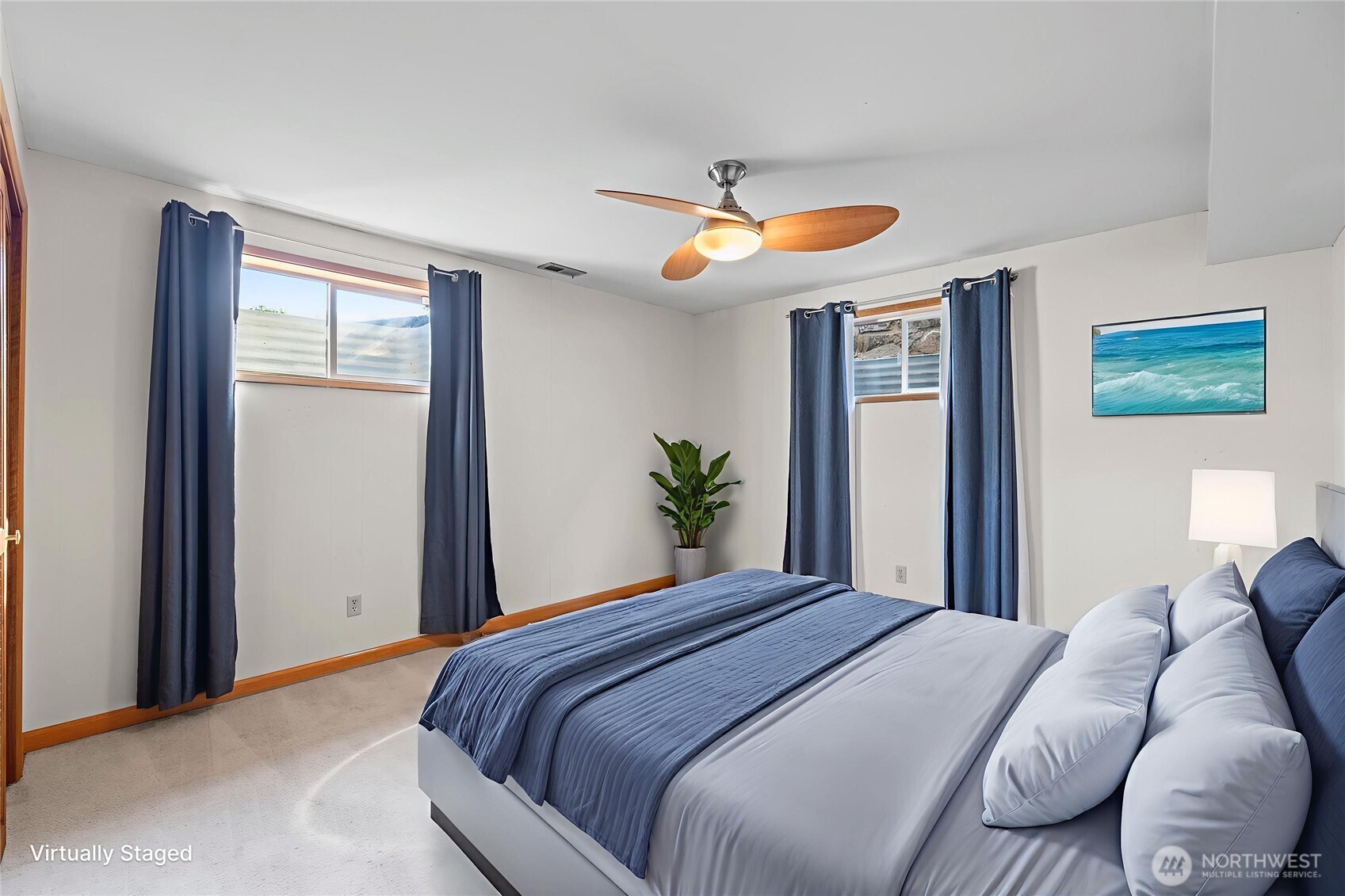 1307 26th Street Anacortes, WA 98221 - Photo 27 of 40 a bedroom with a bed and a large mirror