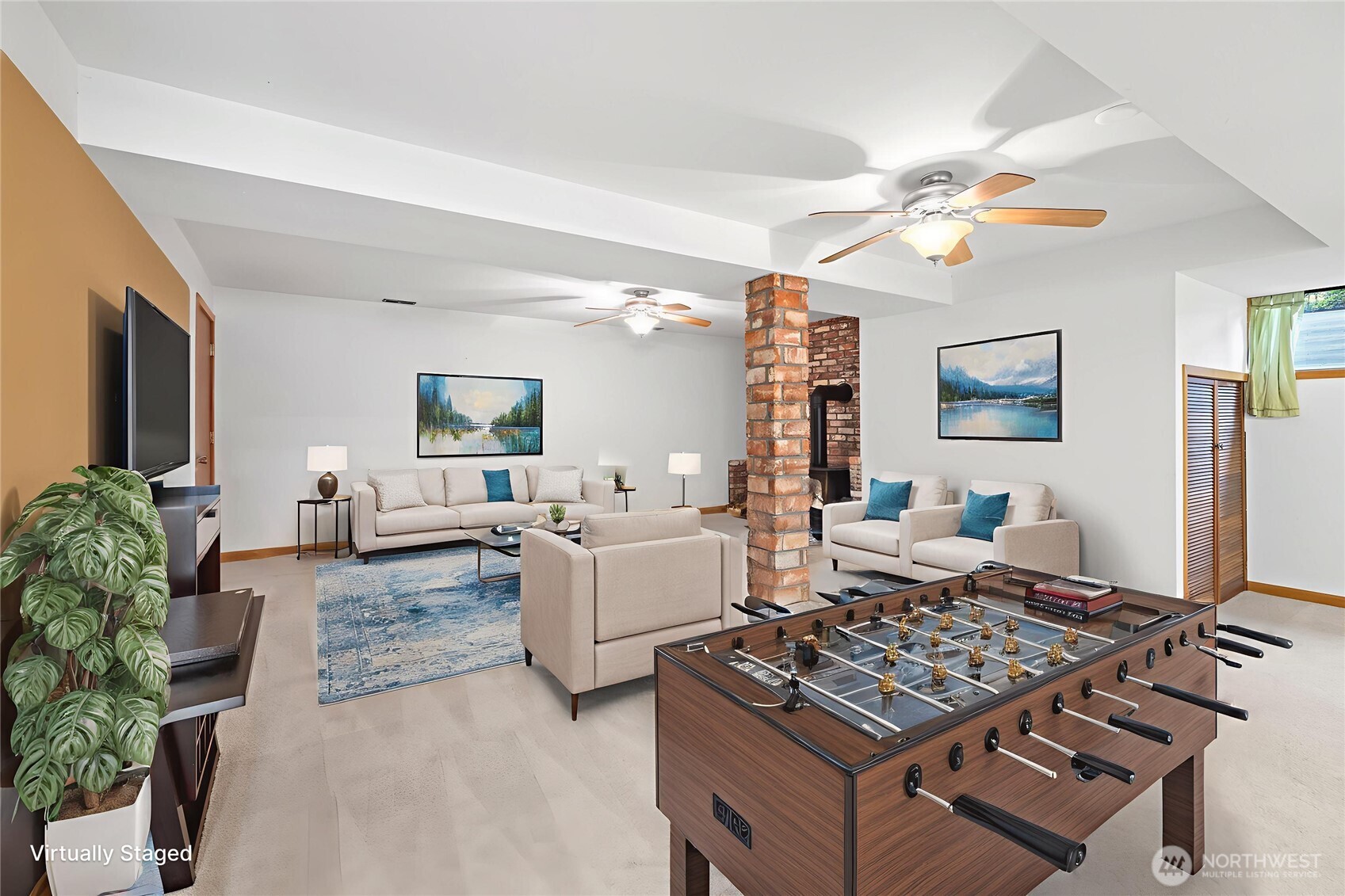 1307 26th Street Anacortes, WA 98221 - Photo 29 of 40 a living room with furniture and a flat screen tv