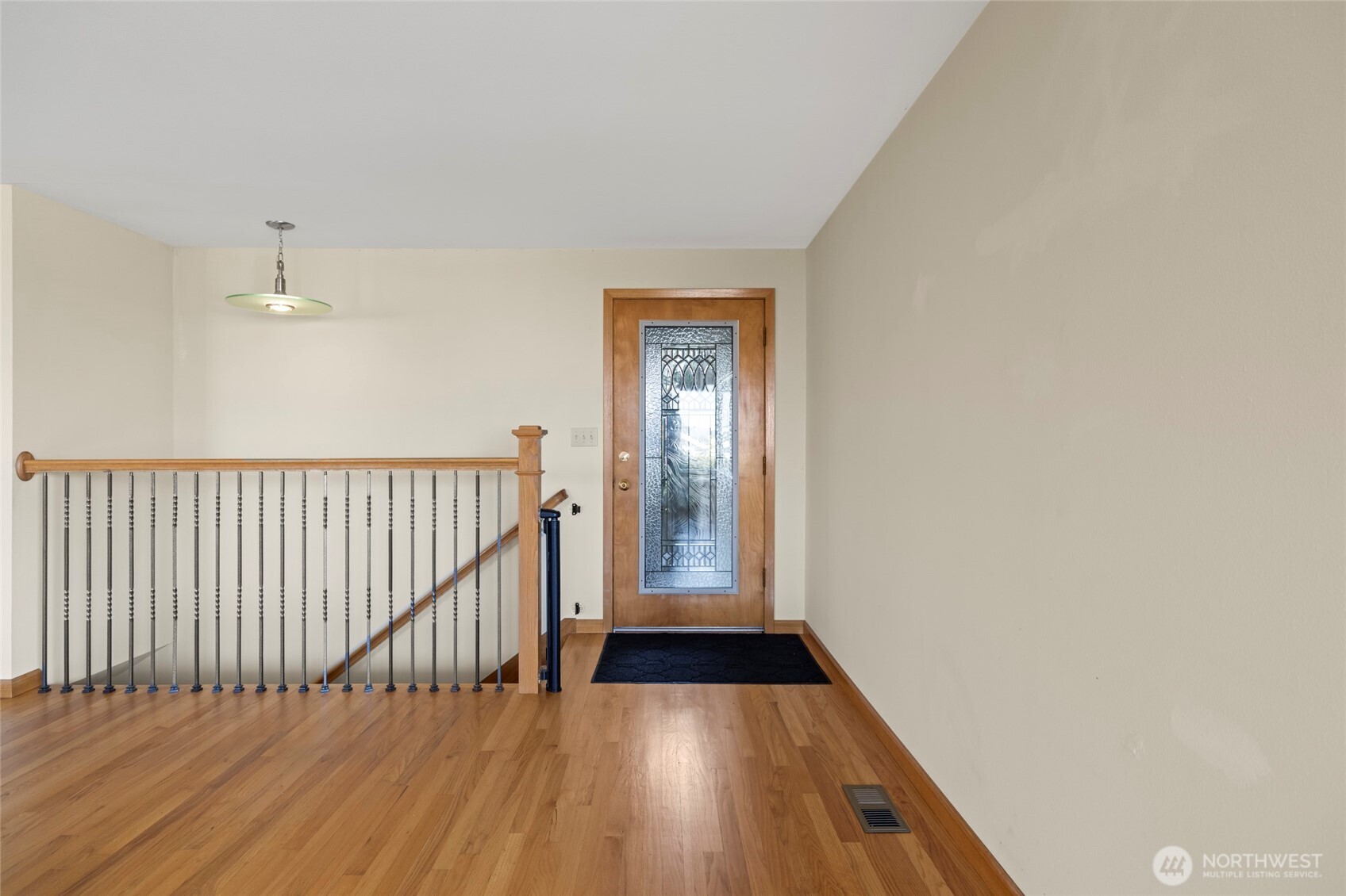 1307 26th Street Anacortes, WA 98221 - Photo 4 of 40 a view of a hallway with wooden floor
