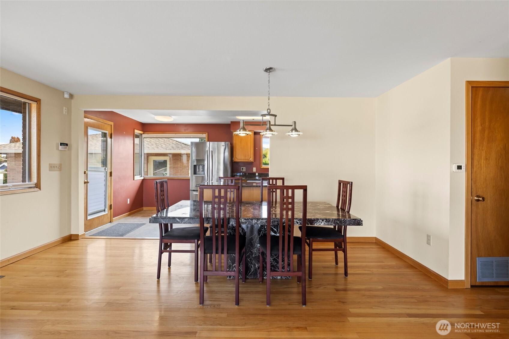 1307 26th Street Anacortes, WA 98221 - Photo 10 of 40 a view of a a dining room with furniture window and wooden floor