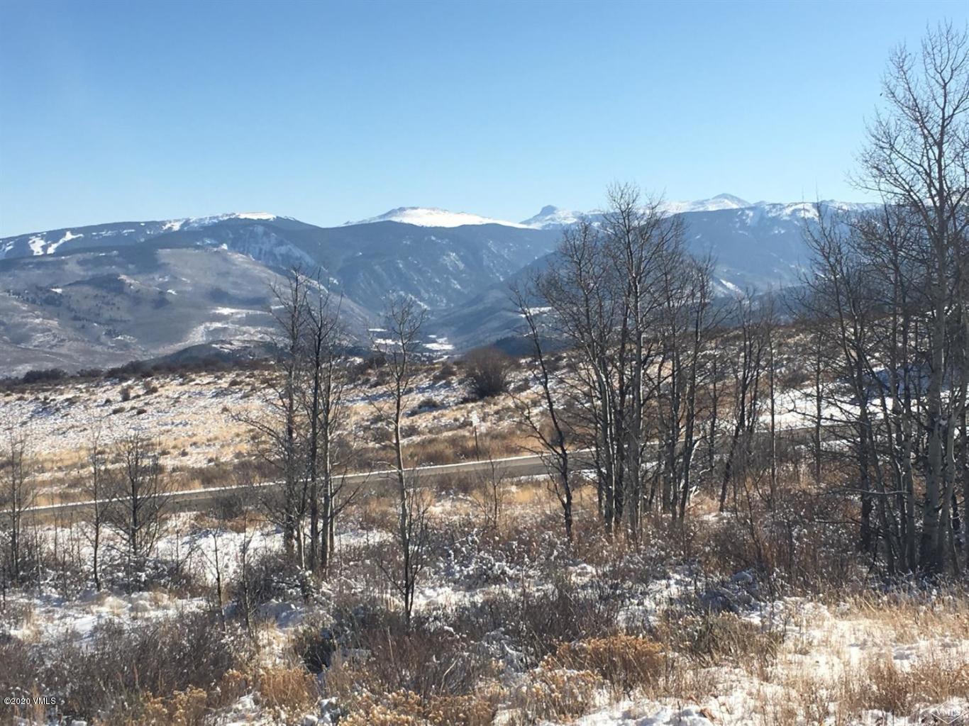 5539 Bellyache Ridge Road Wolcott, CO 81655 - Photo 5 of 6 a view of a dry yard with mountains in the background