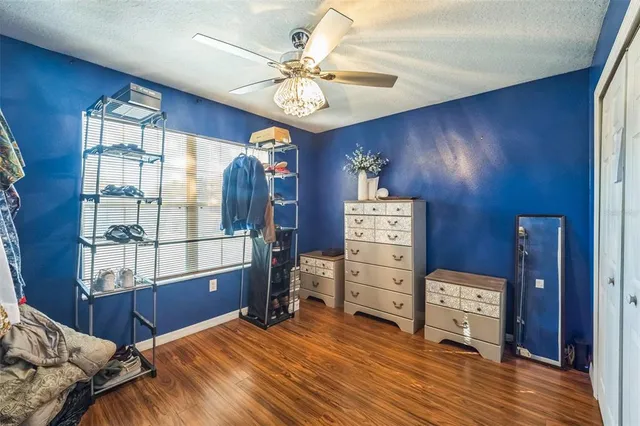 a view of bedroom with furniture and windows