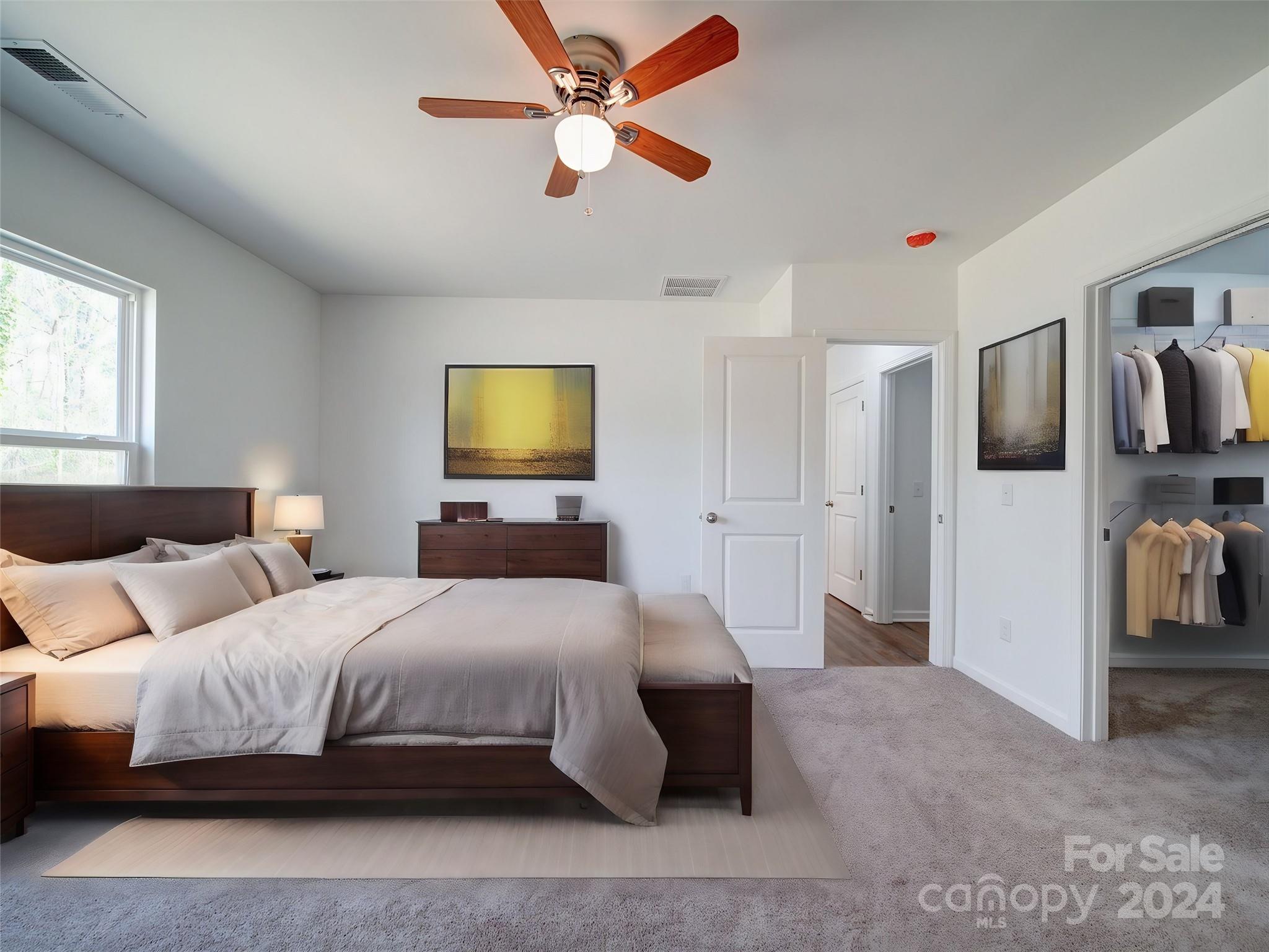 147 Lambeth Road Thomasville, NC 27360 - Photo 14 of 33 a bedroom with a bed flat screen tv and a window