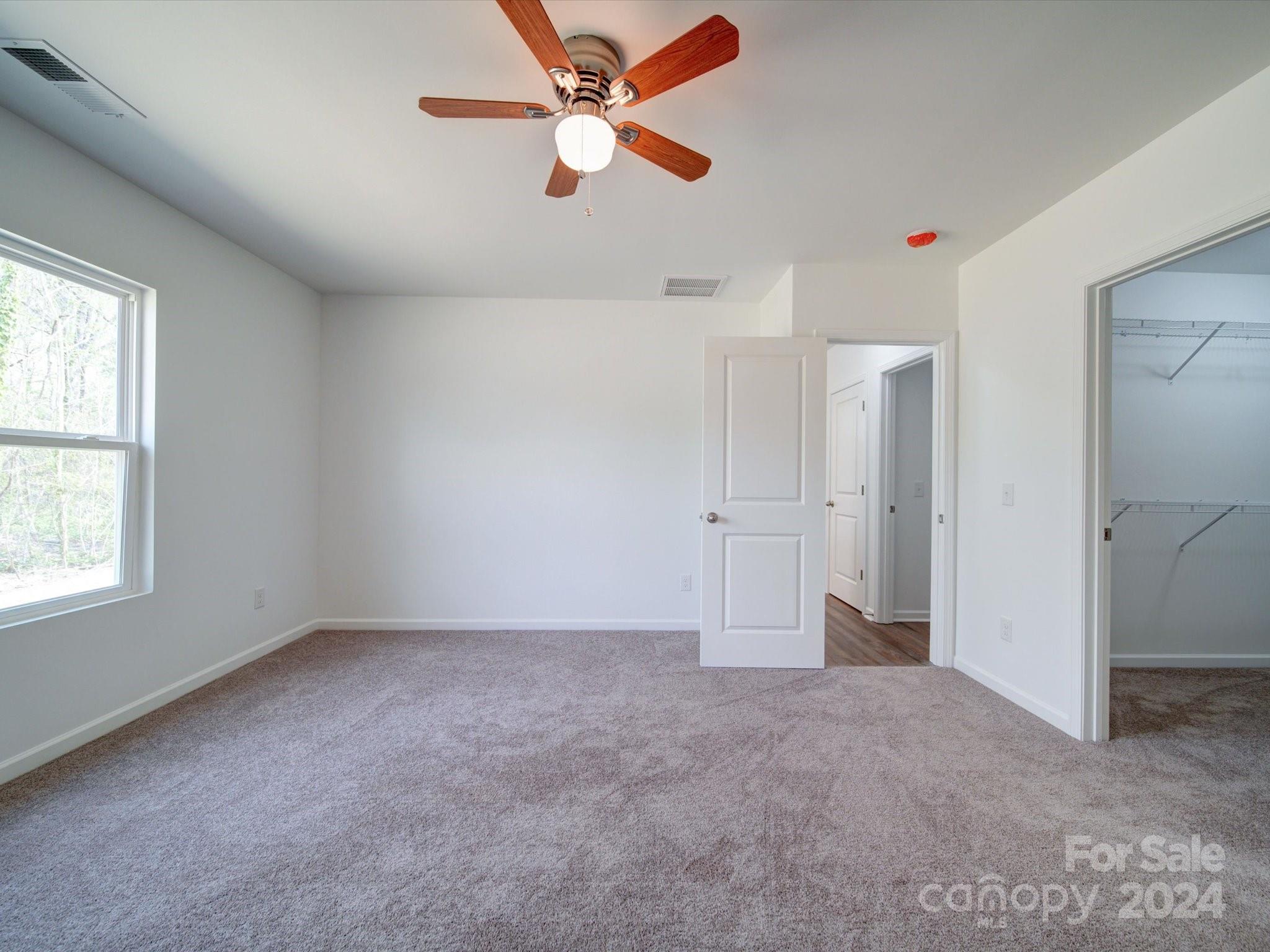 147 Lambeth Road Thomasville, NC 27360 - Photo 15 of 33 an empty room with fan and windows