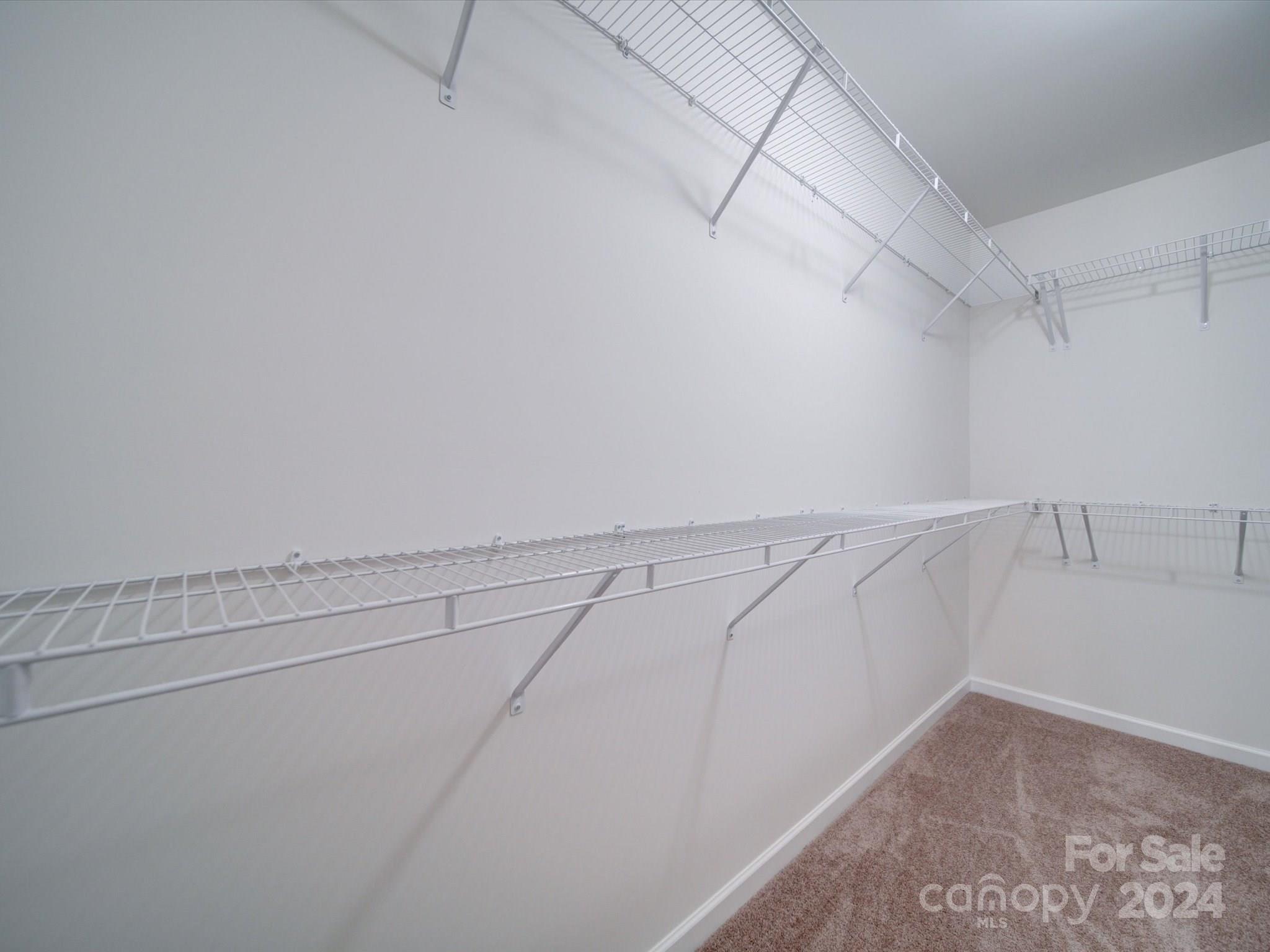147 Lambeth Road Thomasville, NC 27360 - Photo 20 of 33 a view of a room with racks on the wall